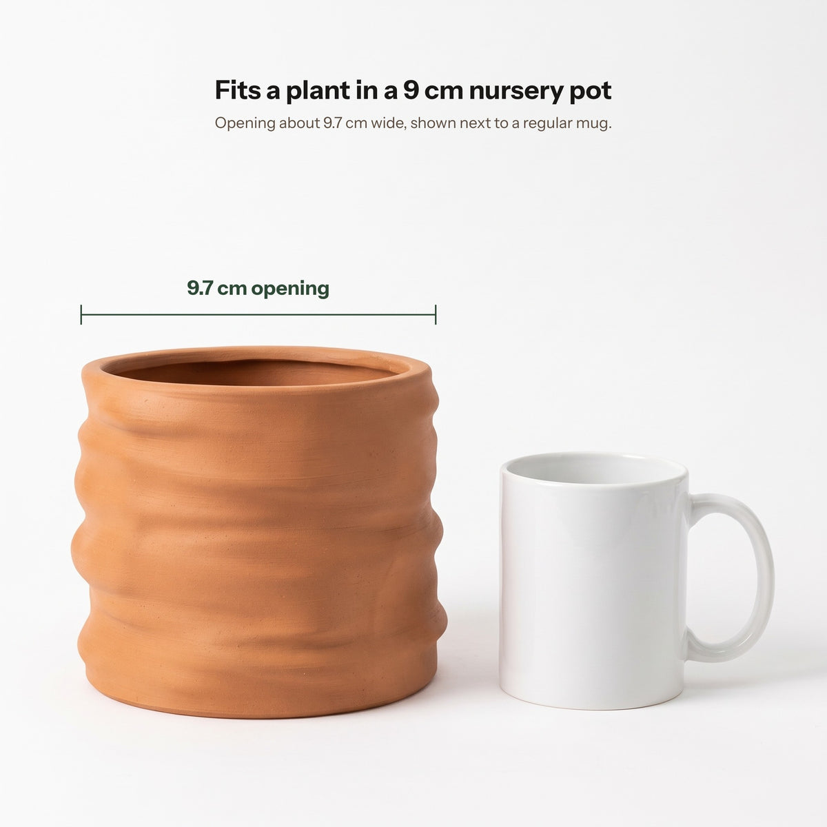 Clayla planter next to a mug, opening about 9.7 cm wide
