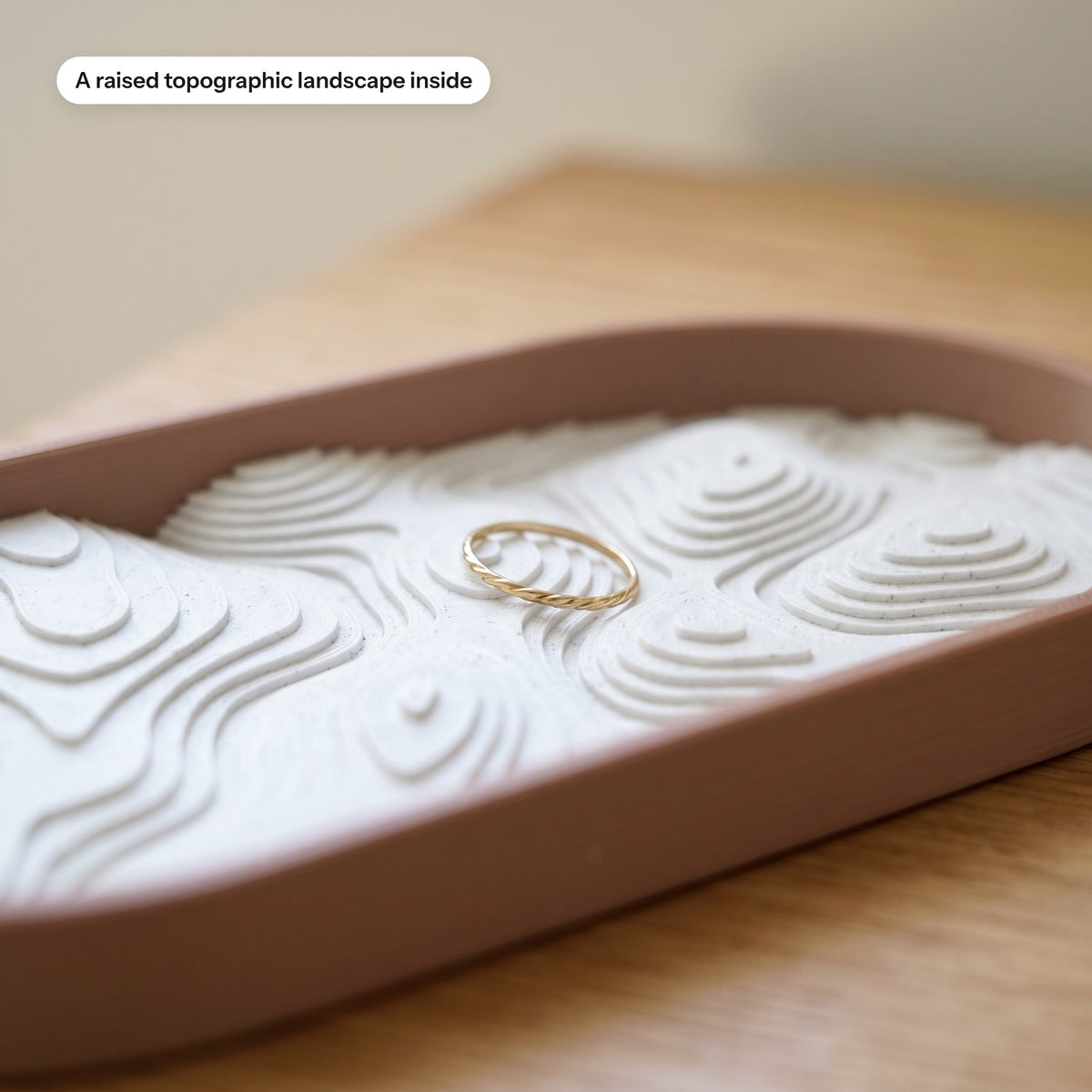 Close-up of the raised topographic landscape inside the tray