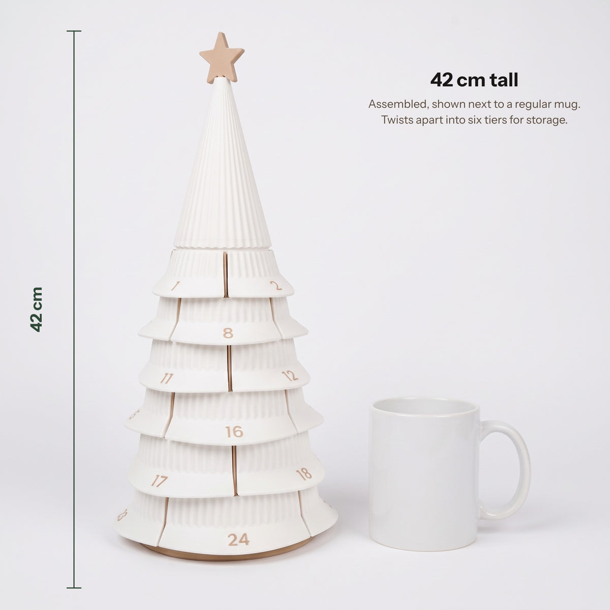 42 cm tall, next to a mug