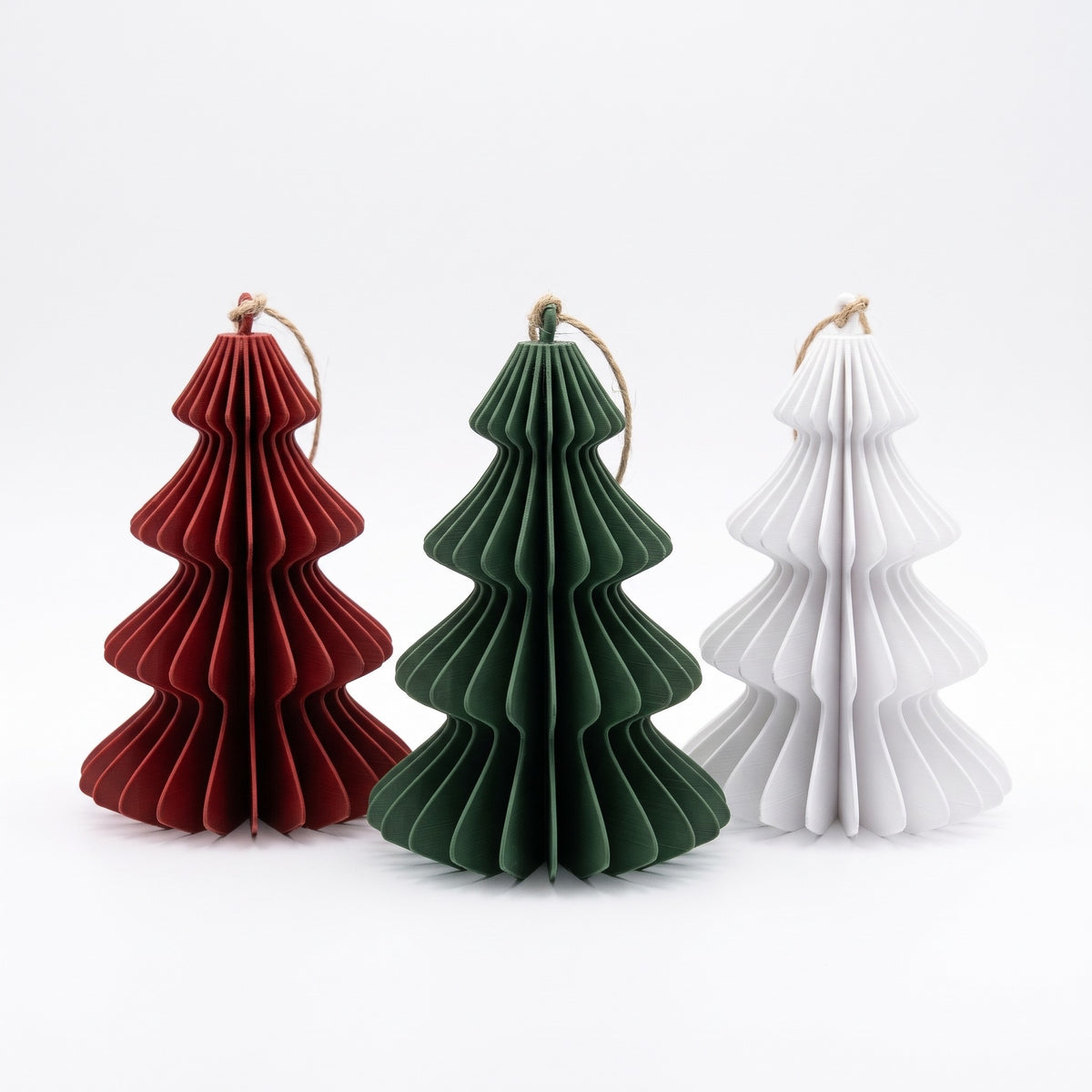 Three ornaments in red, green and white
